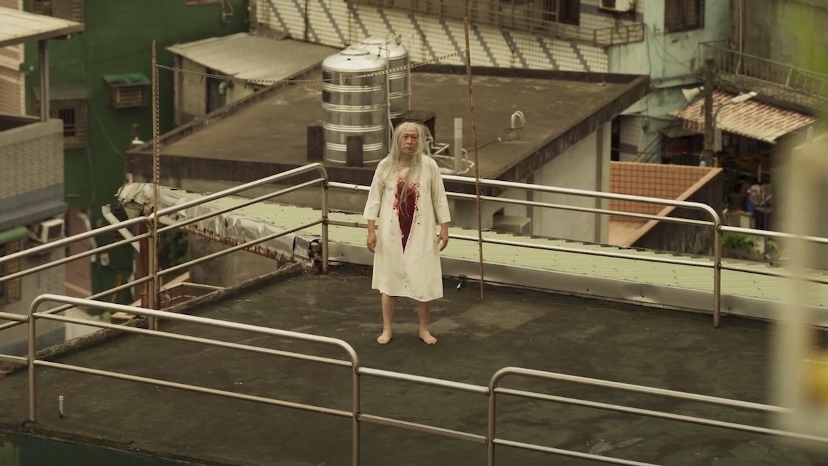 A bloodied woman stands on a rooftop in The Sadness - best new streaming movies