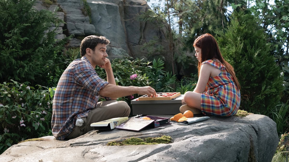 A man and a child play checkers outdoors in The Time Travellers Wife - shows like shining girls