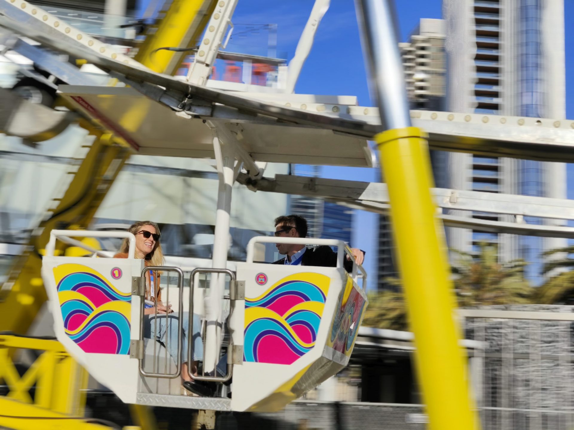 vivo X80 Pro sports pan showing two people on a colorful carousel