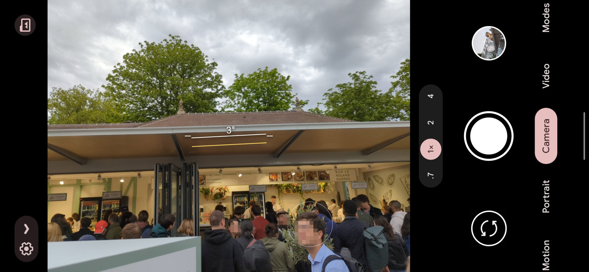 Screenshot of the Google Pixel 6 Pro camera at 1x shows a grocery store with a long line.