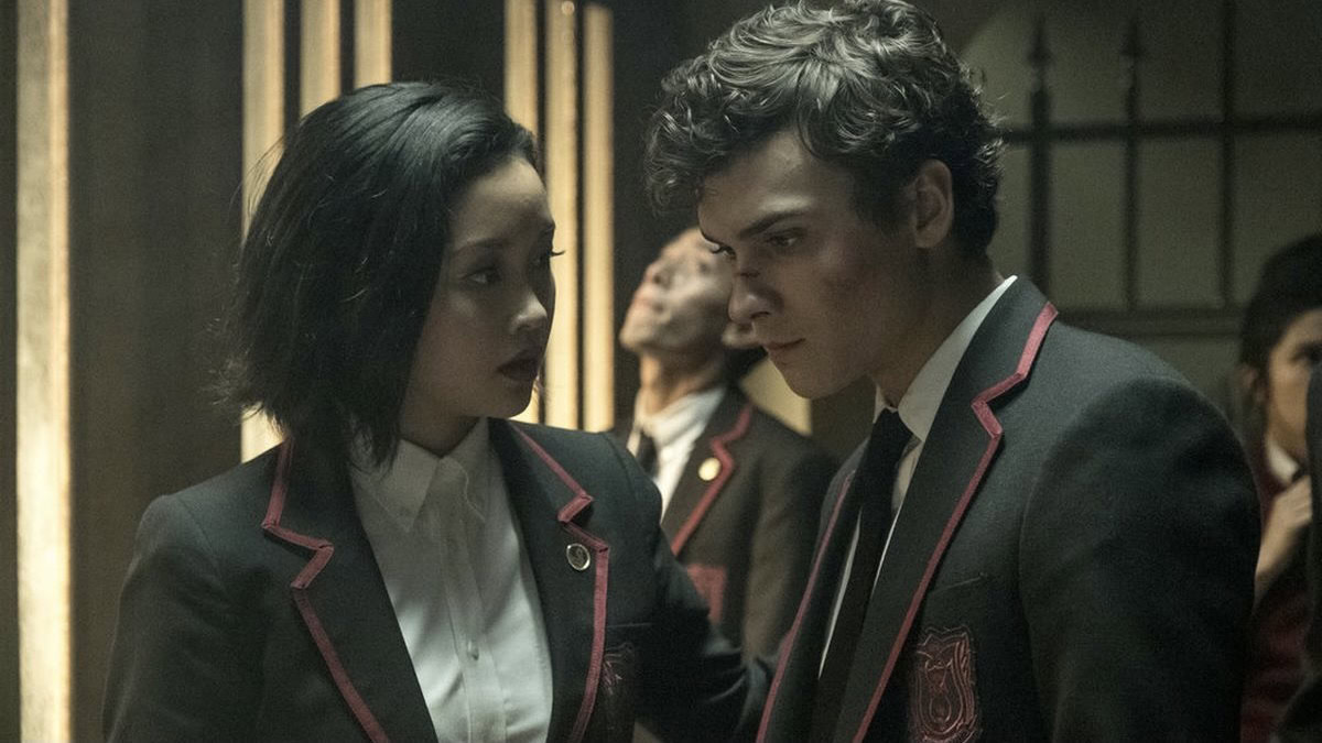 A teen boy and girl in private school uniforms in Deadly Class - shows like the umbrella academy