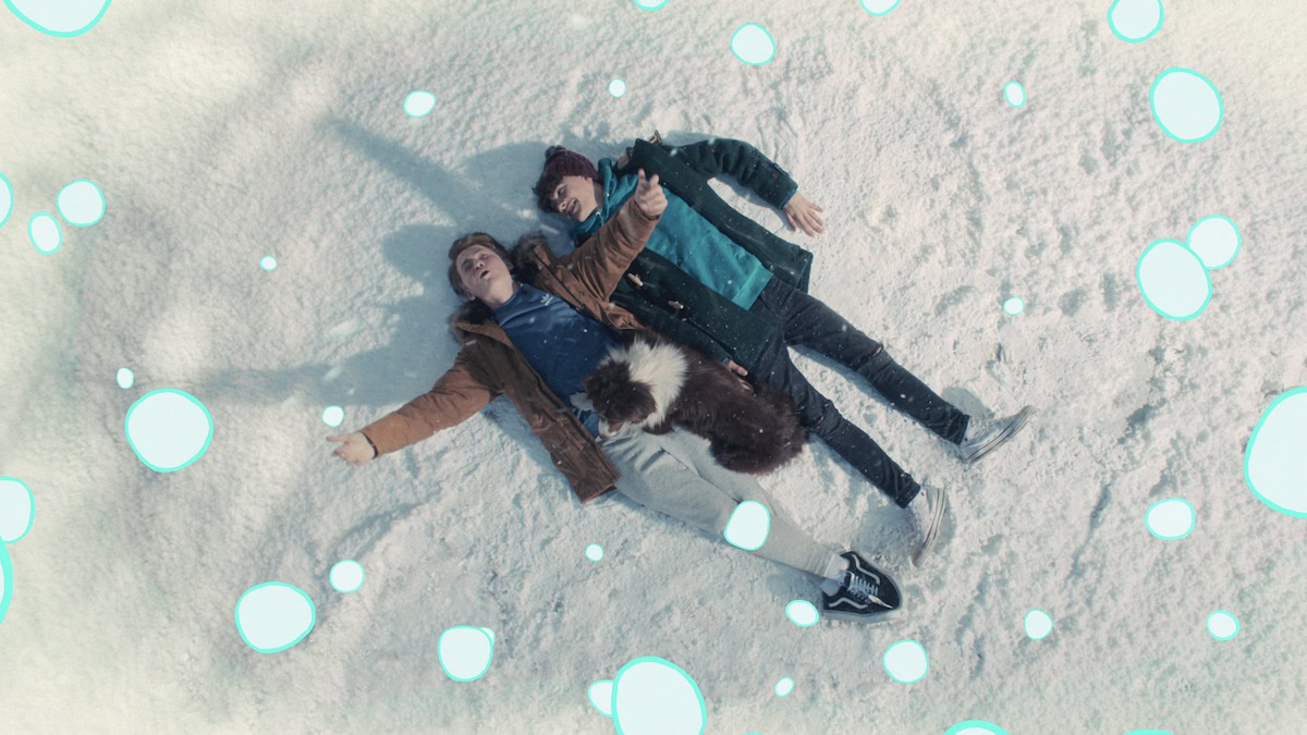 Two boys making snow angels together in Heartstopper - best lgbtq shows