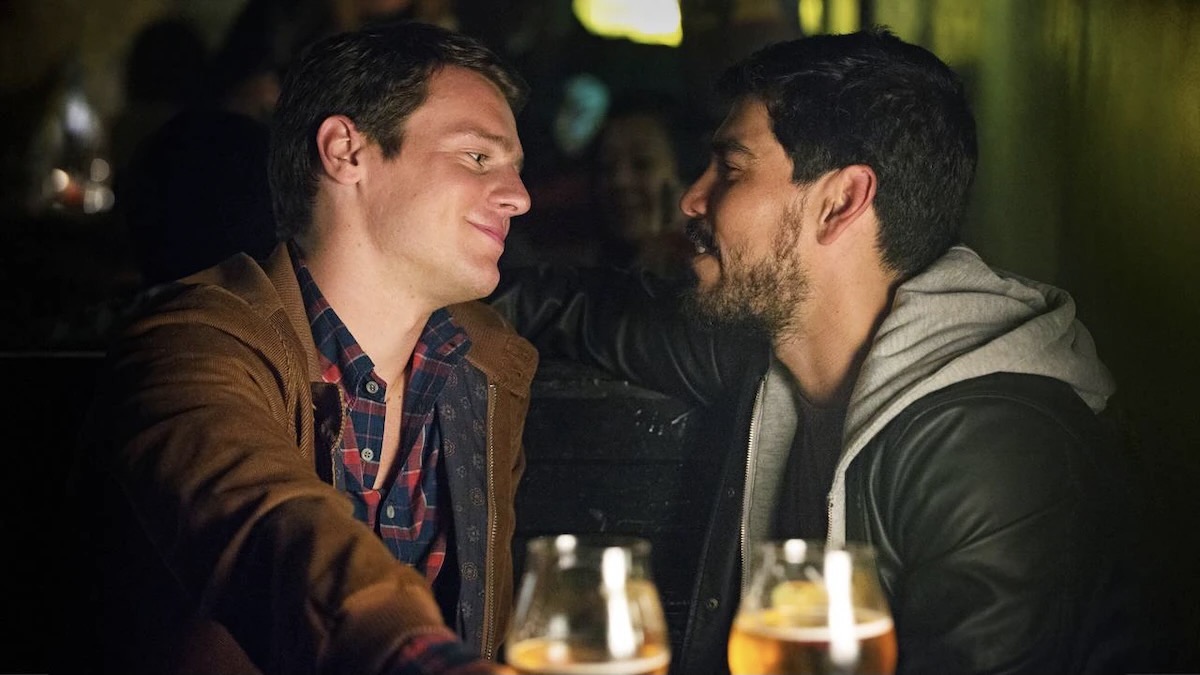 Two men look into each others eyes while out for drinks in Looking