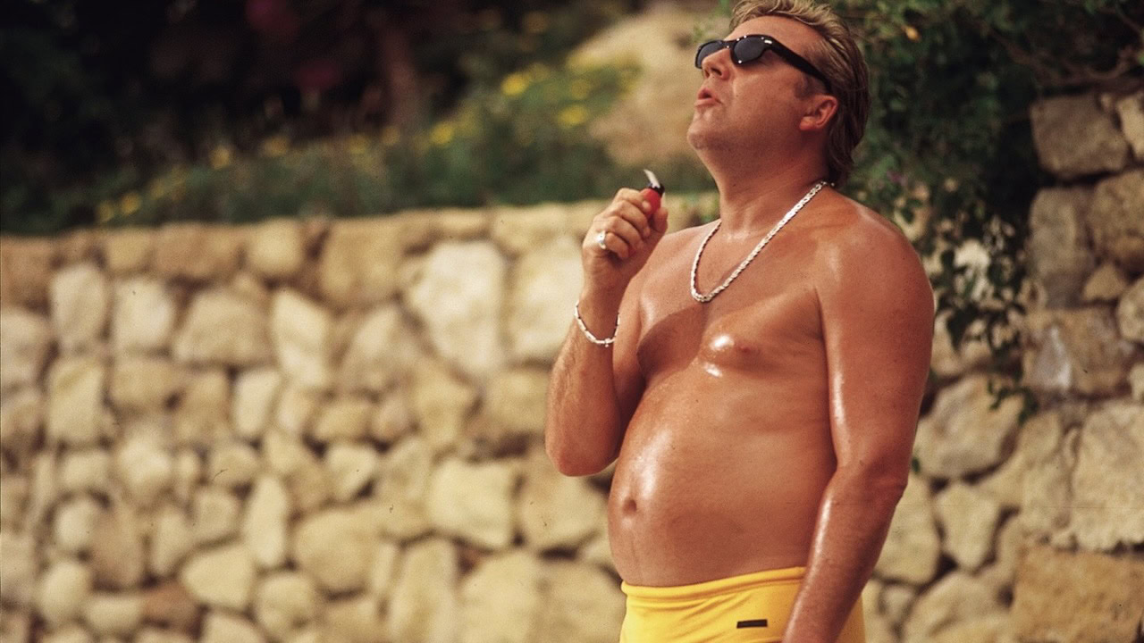 Ray Winstone smokes in a bathing suit in Sexy Beast