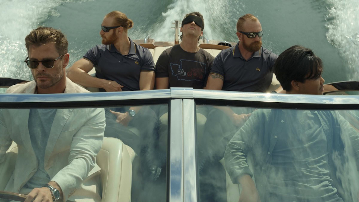 Five men in a powerboat, with one blindfolded, in Spiderhead