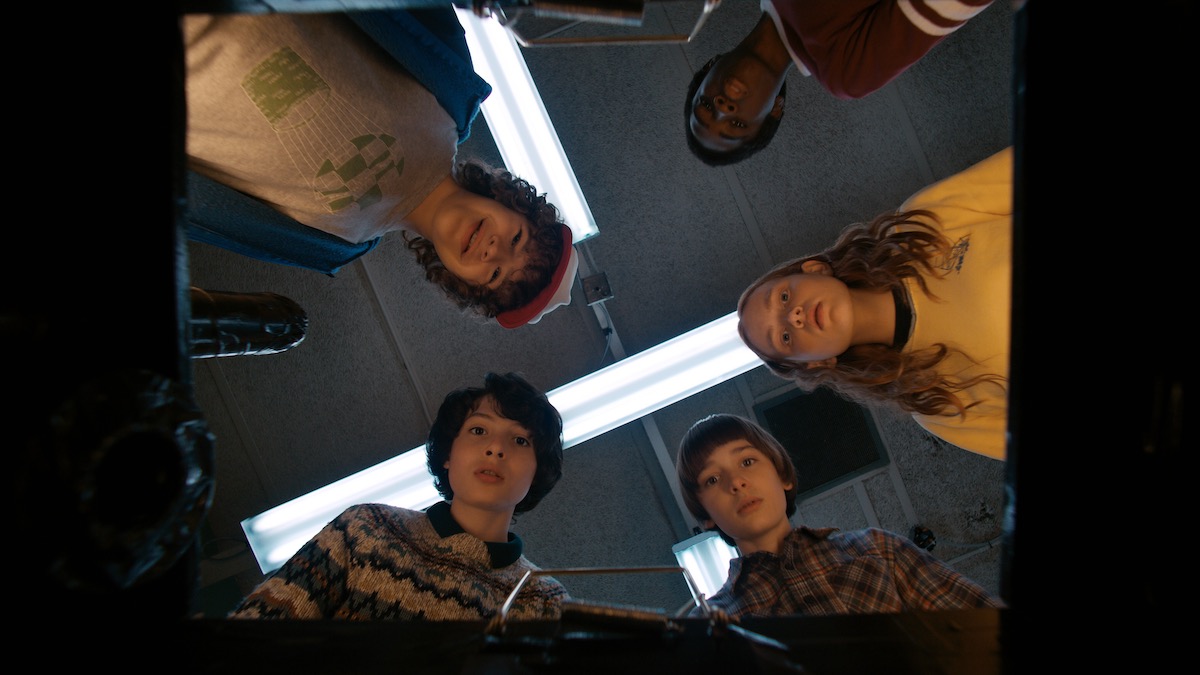 Kids looking into a box in Stranger Things