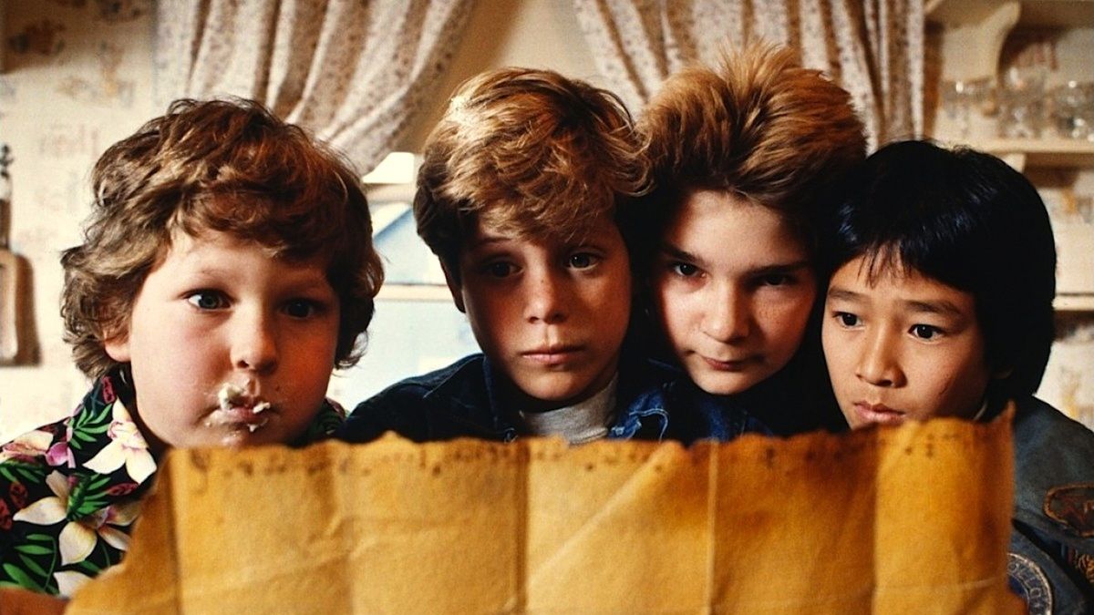 boys look at a treasure map in The Goonies - movies like Stranger Things