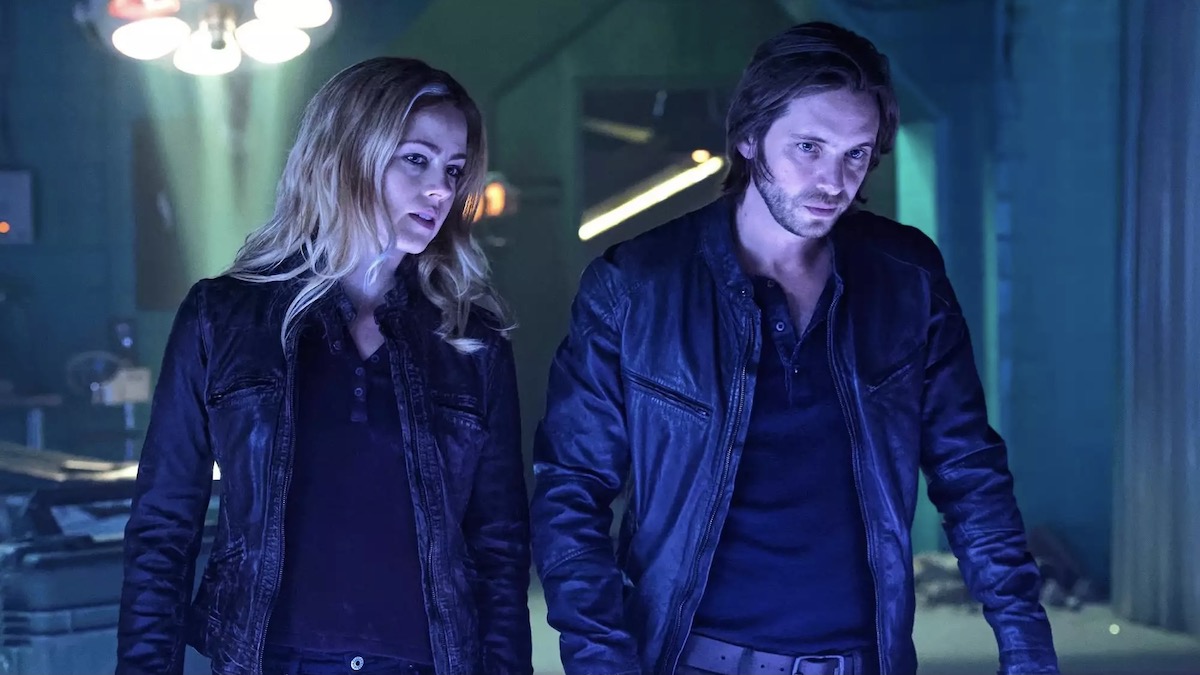 A man and woman stand together in 12 Monkeys - shows like resident evil
