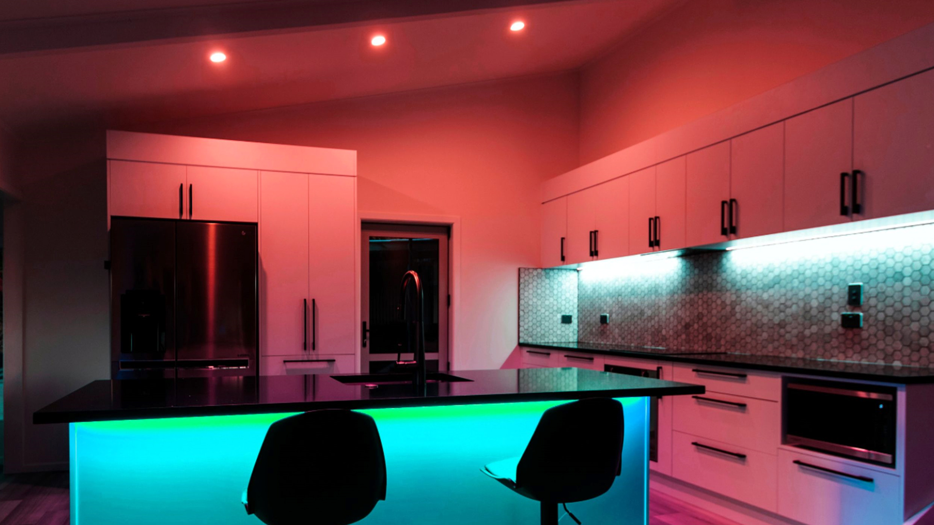 A kitchen illuminated with light strips and Lifx smart bulbs