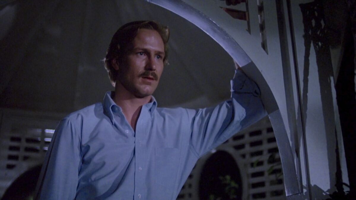 William Hurt in a doorway in Body Heat - best heat wave movies