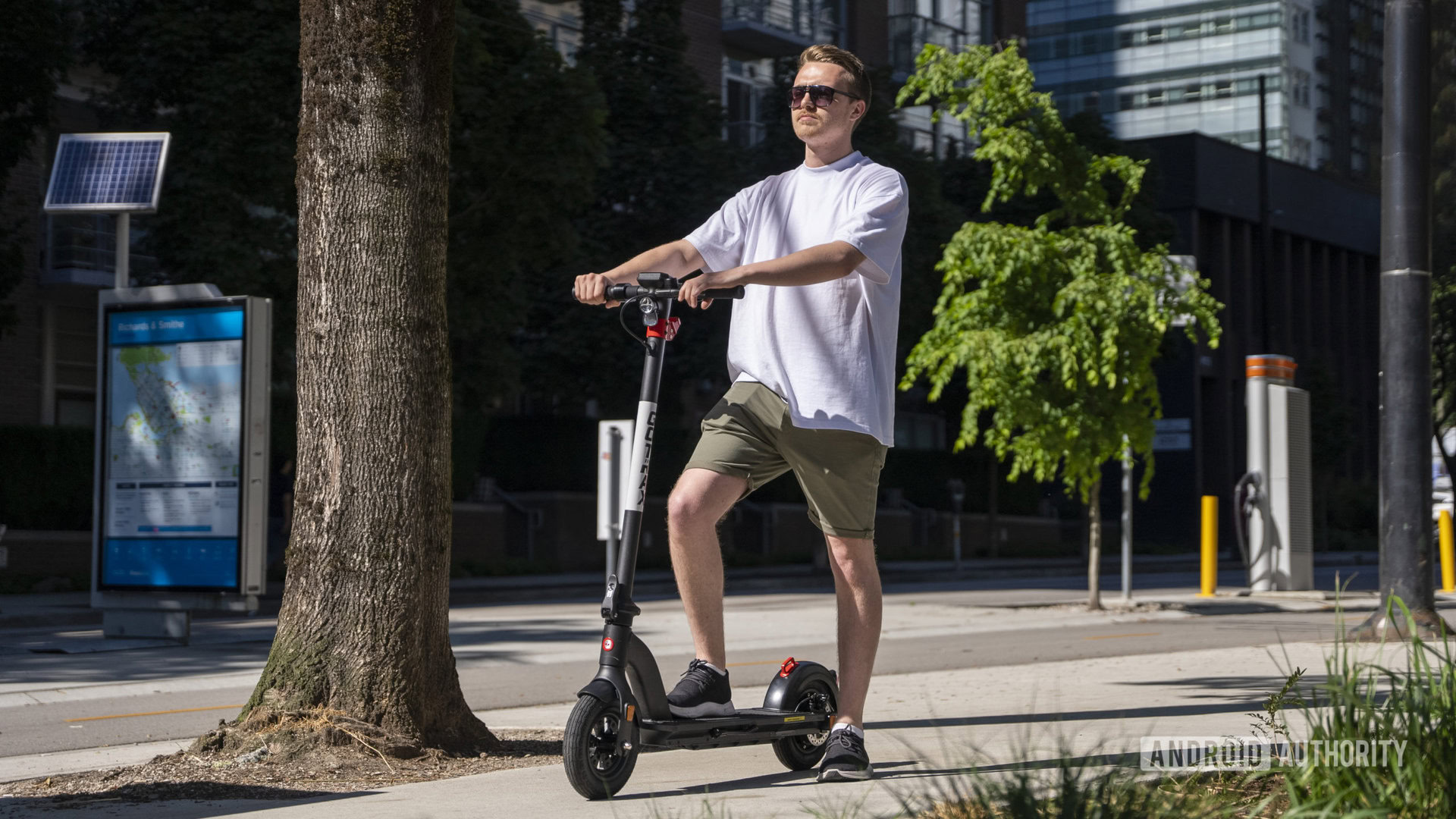 standing on e-scooter in sunshine