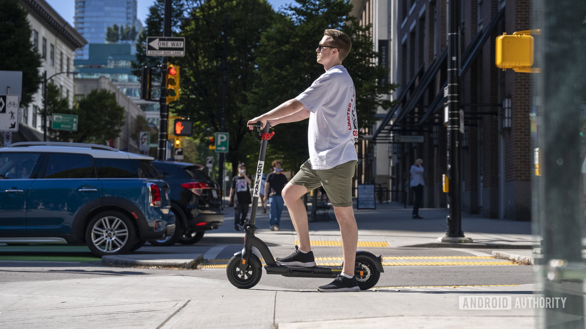 Standing on e-scooter at stop light