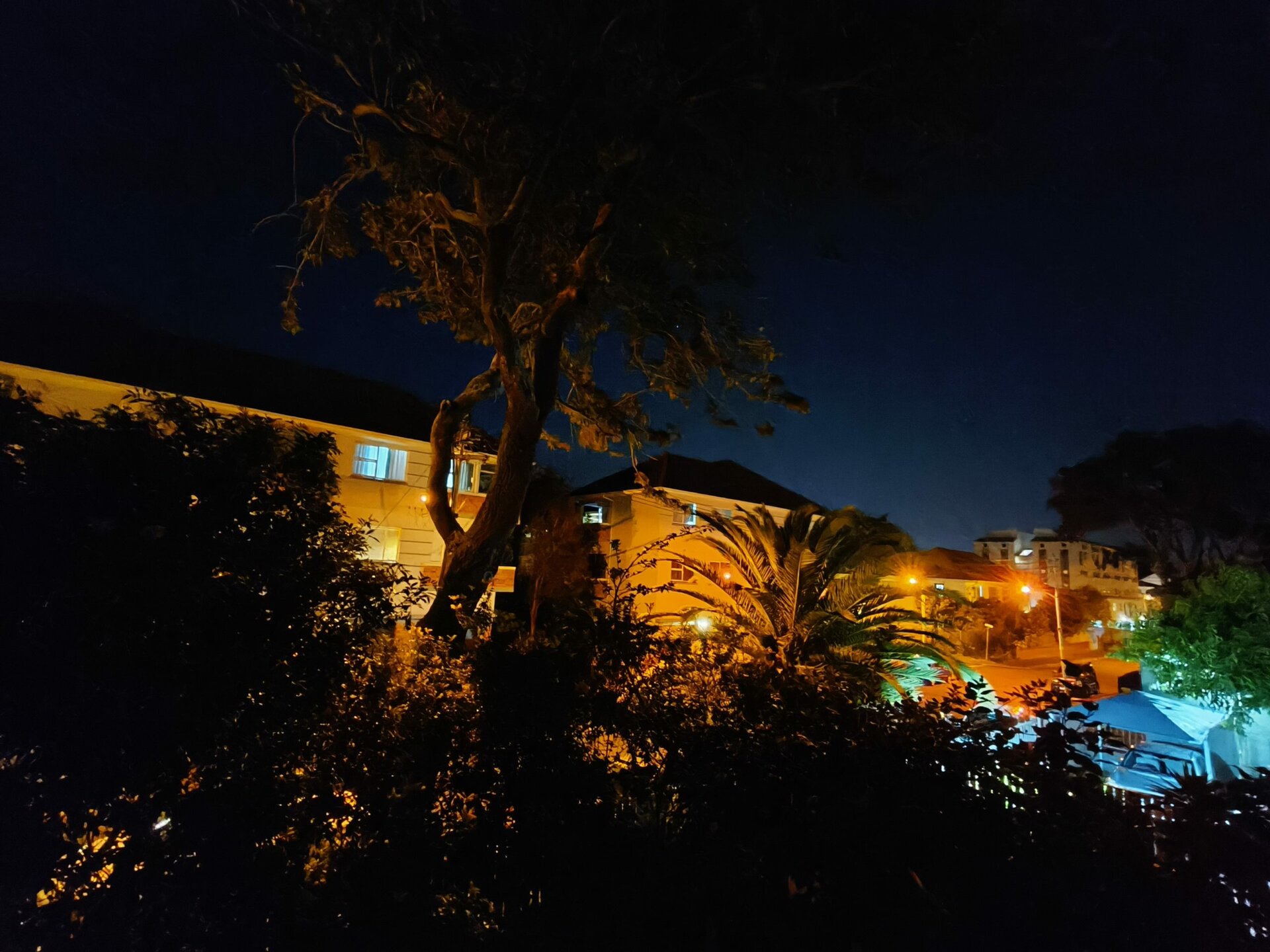 Oppo Reno 8 Pro UW night mode shot of houses lit up after dark.