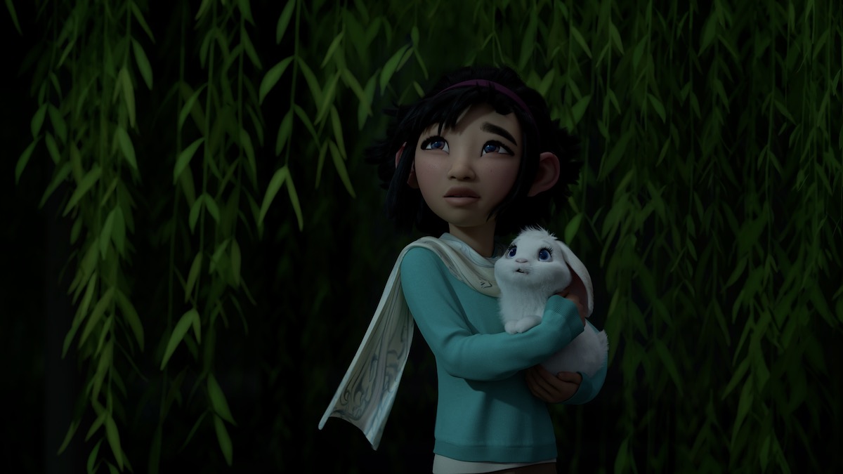 A little girl holds a white rabbit (animated) in Over the Moon
