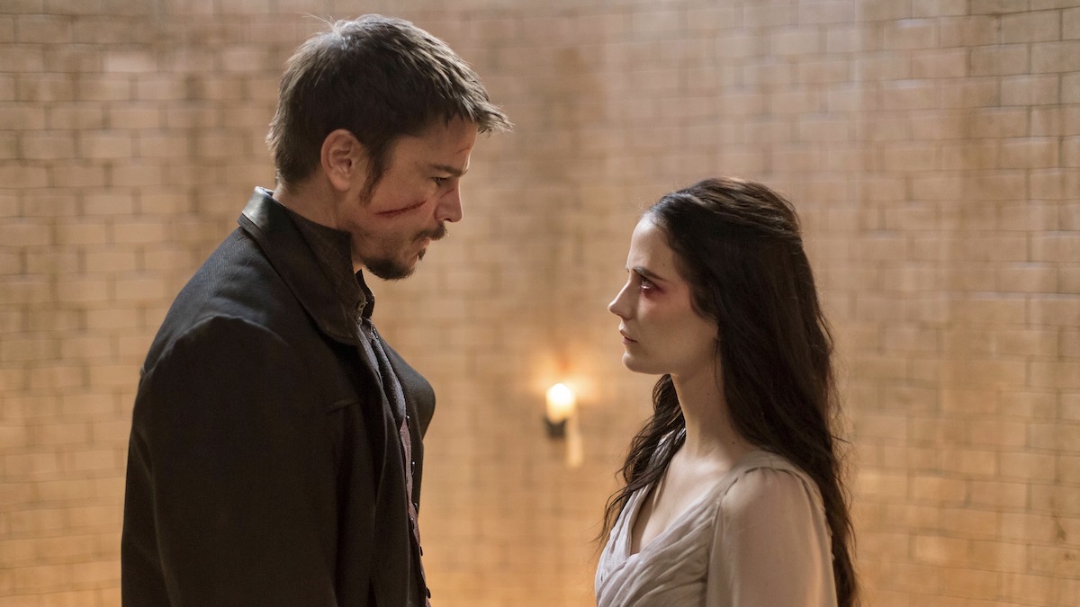 A man and a woman face off, both bruised and bloodied, in Penny Dreadful - shows like Peaky Blinders