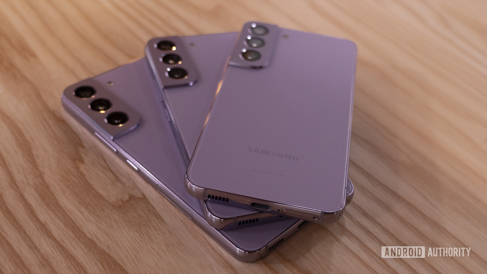 Samsung Galaxy S22 Bora Purple Three Phones Stacked Showing Rails