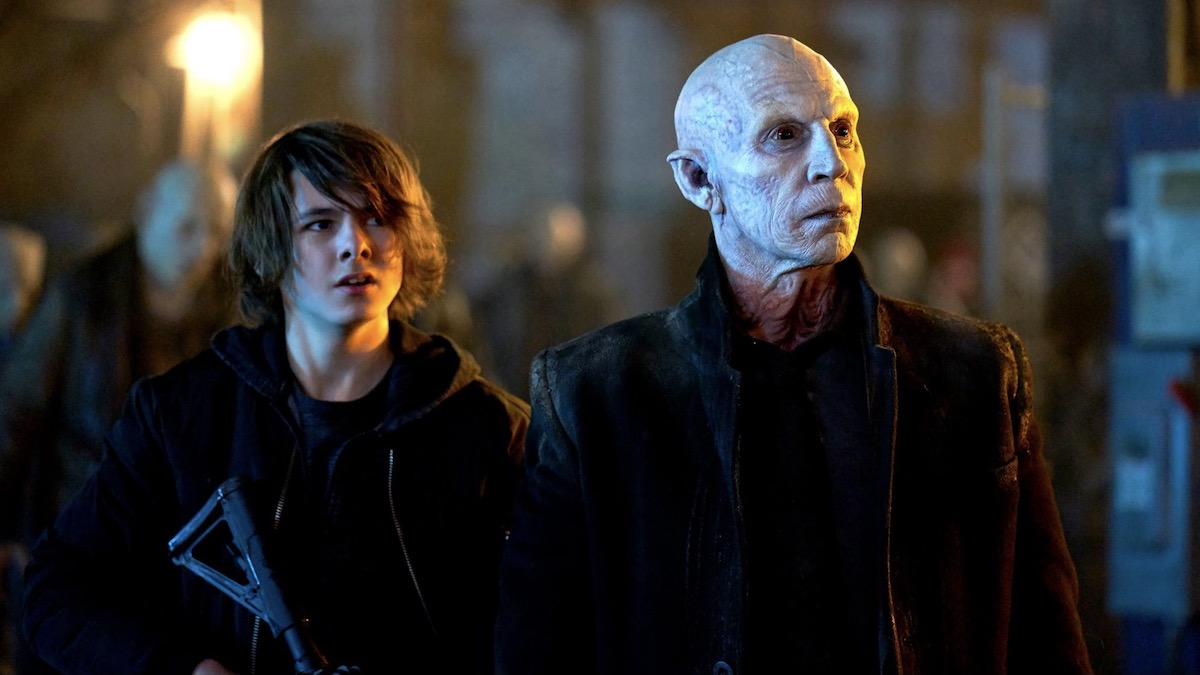 A man and a vampire stand together in The Strain - shows like resident evil