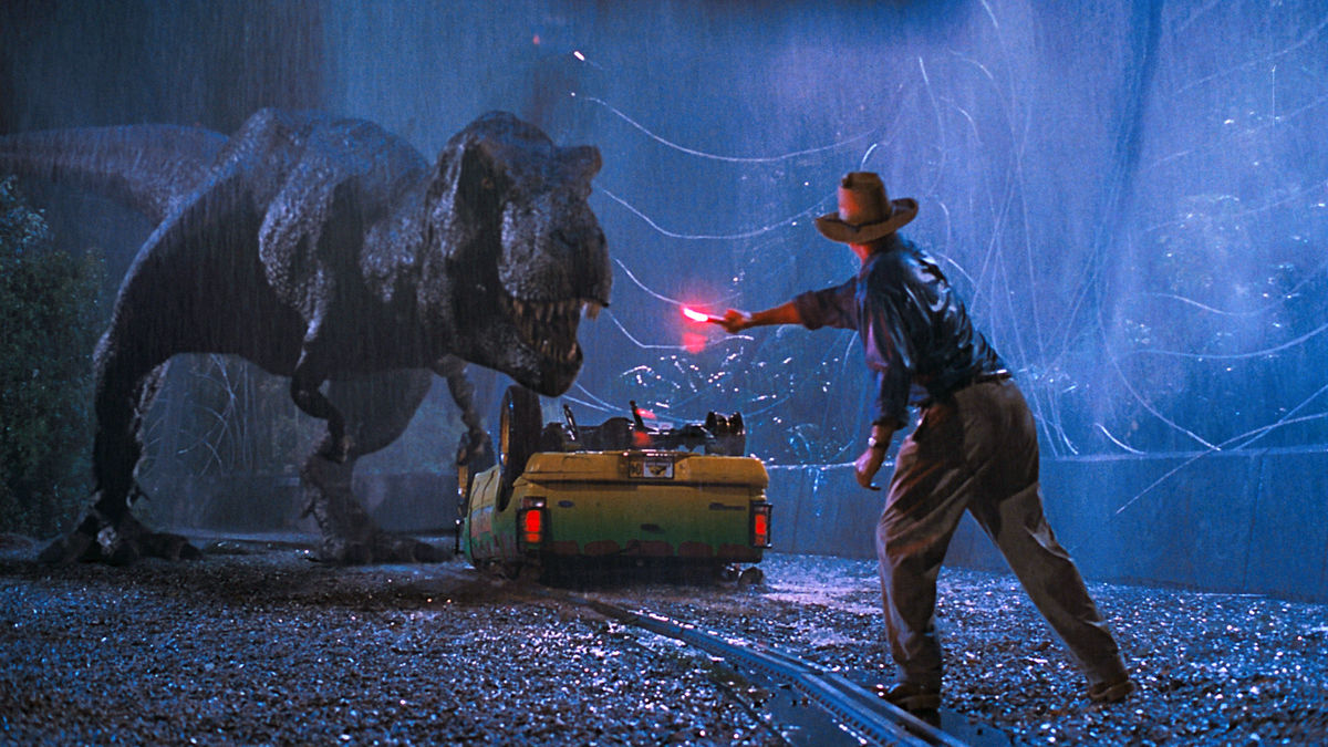Sam Neill distracts a t-rex with a road flare in jurassic park - best peacock movies