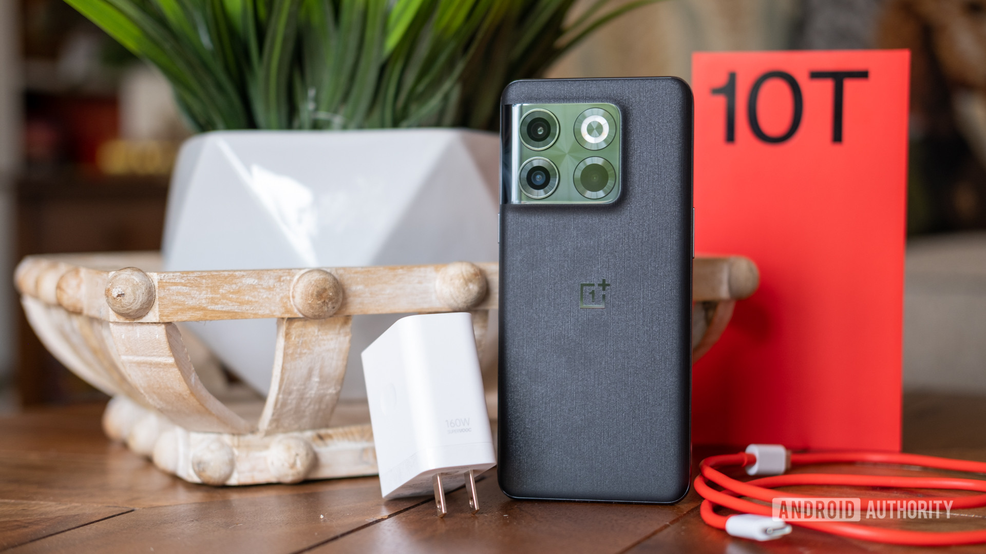oneplus 10t standing with box and charger