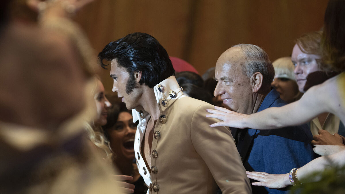 Elvis Presley and Col. Tom Parker walk through a crowd in Elvis - best new streaming movies