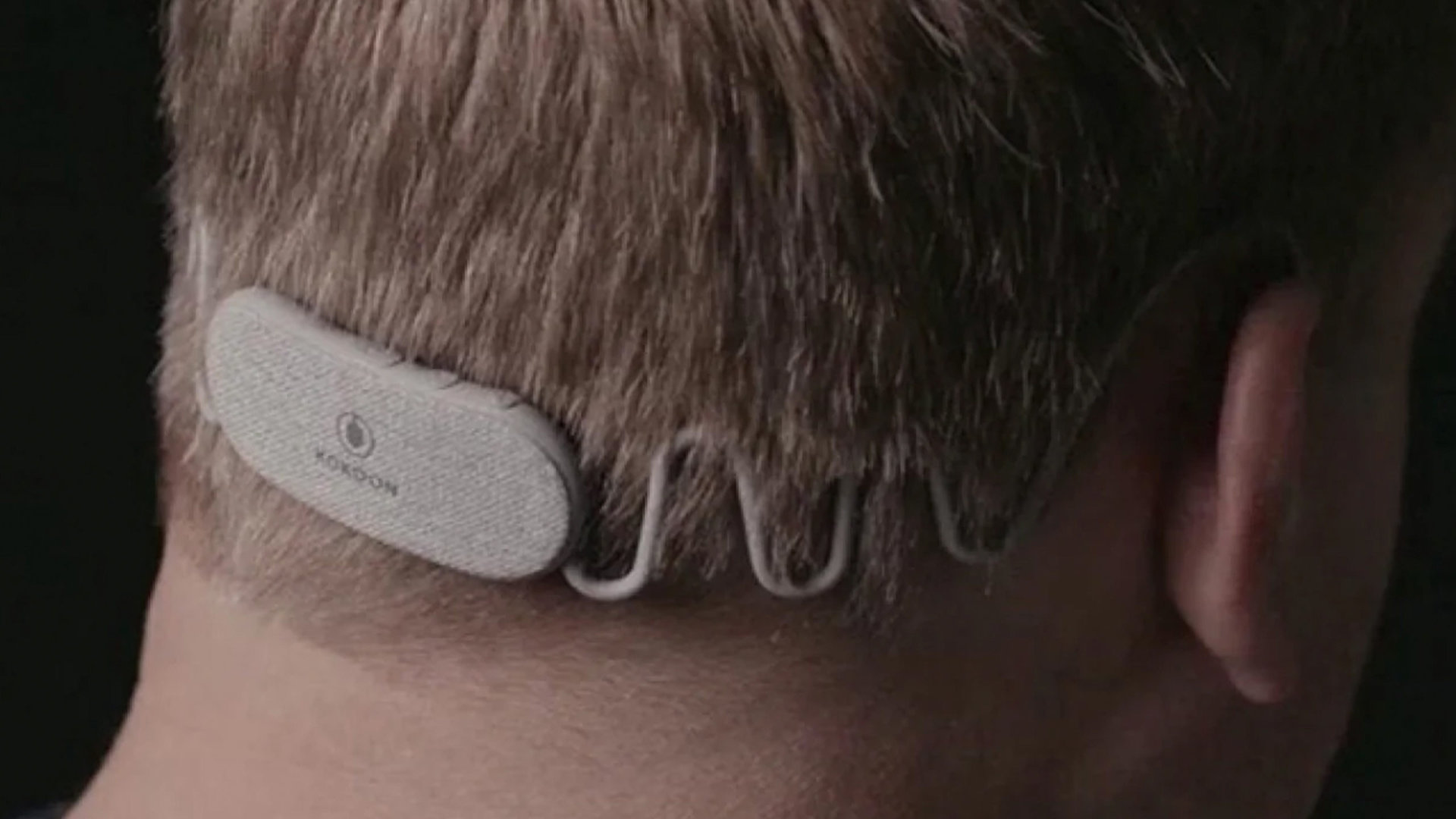 A user wears a pair of Kokoon Nightbuds, the best sleep tracking earbuds.