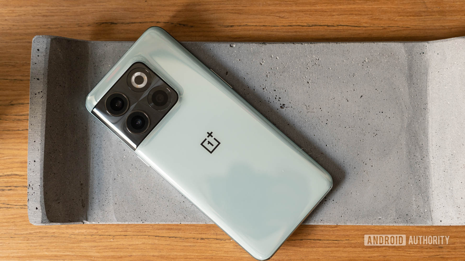 OnePlus 10T placed on a concrete slab