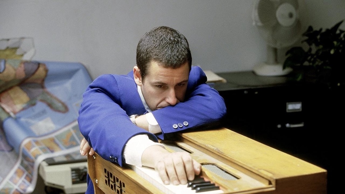 Adam Sandler hunched over an organ in Punch Drunk Love - new on hulu