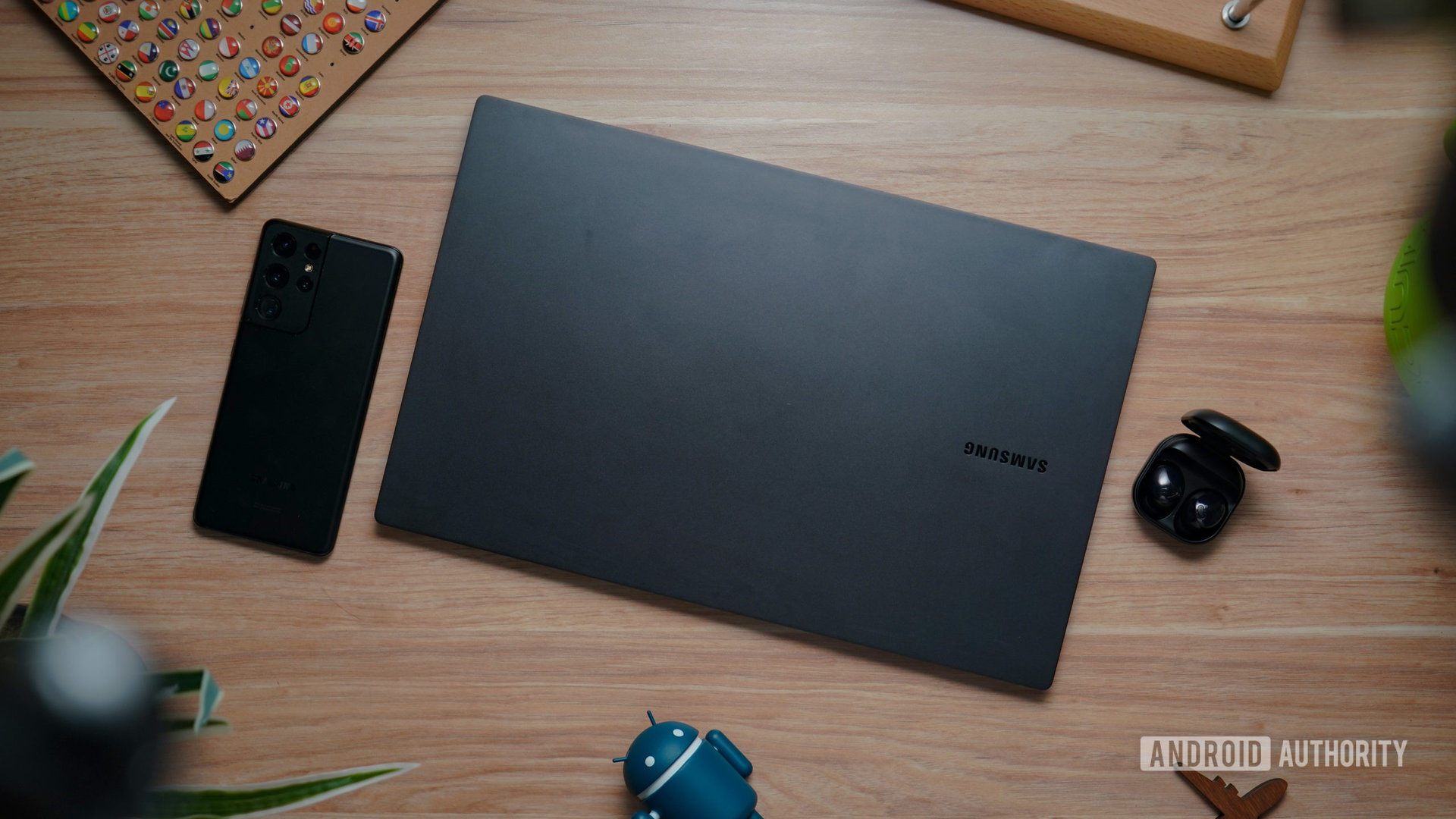 SAMSUNG GALAXY BOOK2 PRO with phone and buds closed