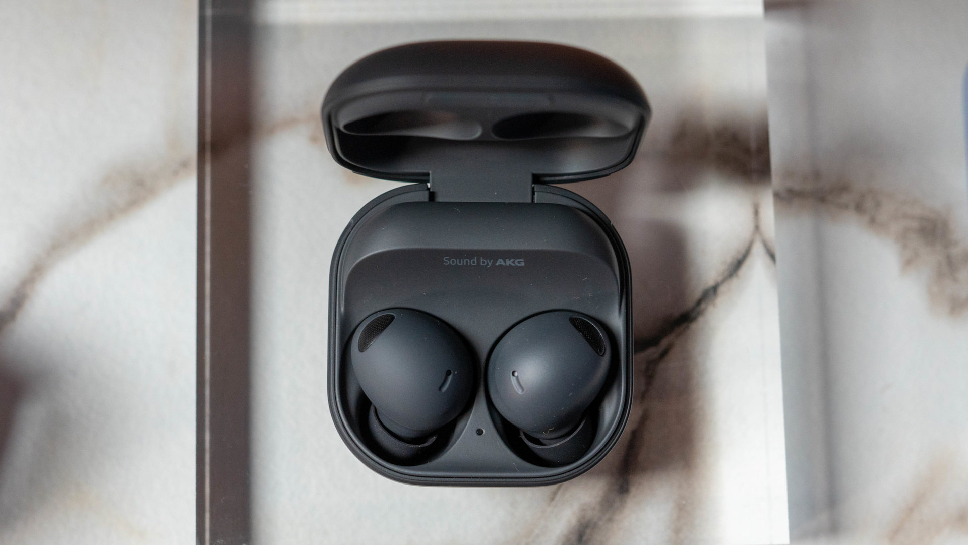 Samsung Galaxy Buds 2 Pro in graphite black color in charging case from above