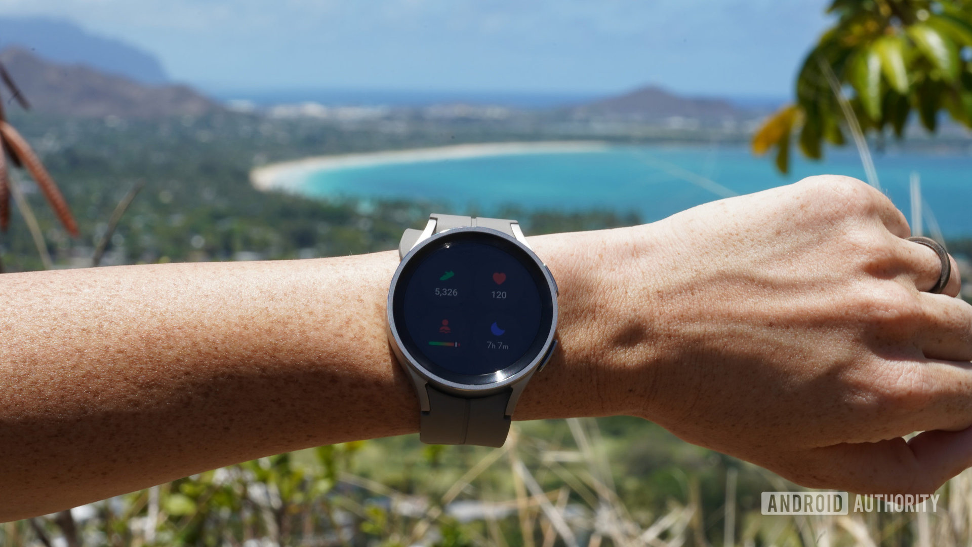 A Samsung Galaxy Watch 5 Pro displays a user's basic stats including step count, sleep data, heart rate, and stress.