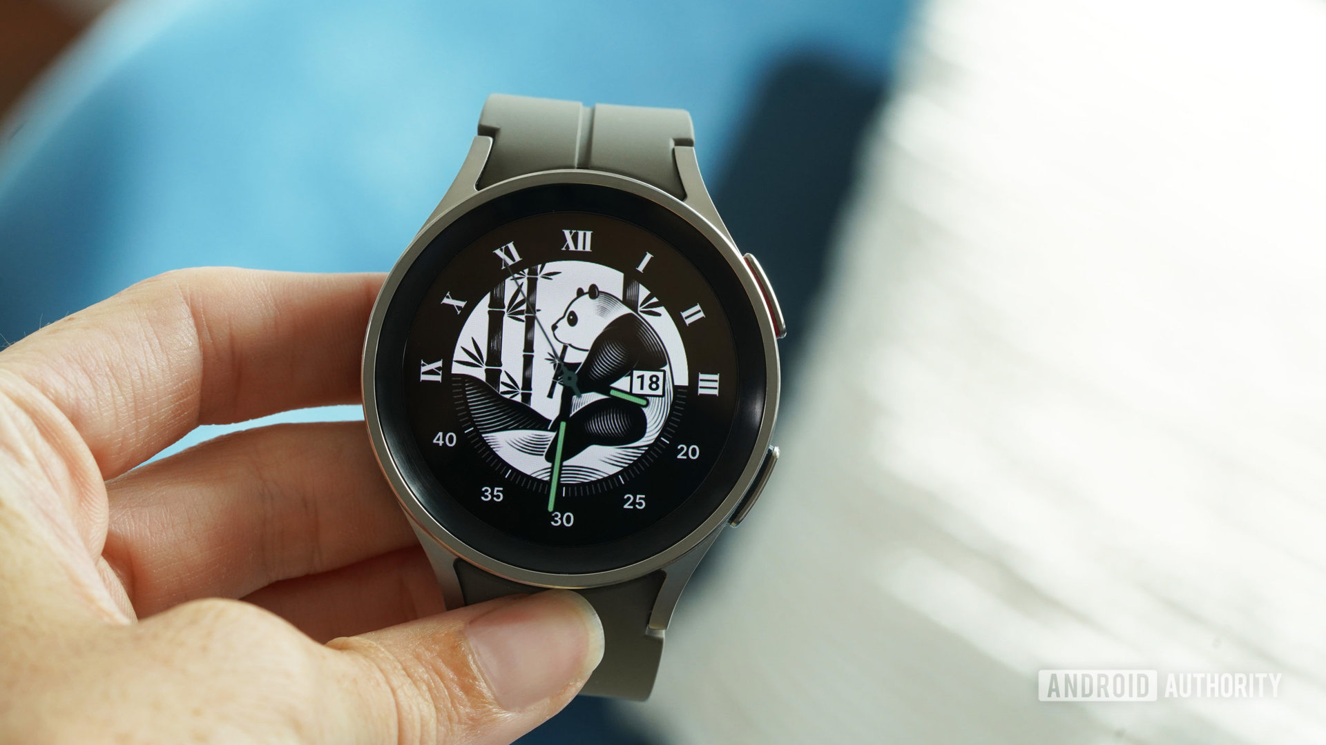 A Samsung Galaxy Watch 5 Pro displays a customizable, endangered animal watch face.