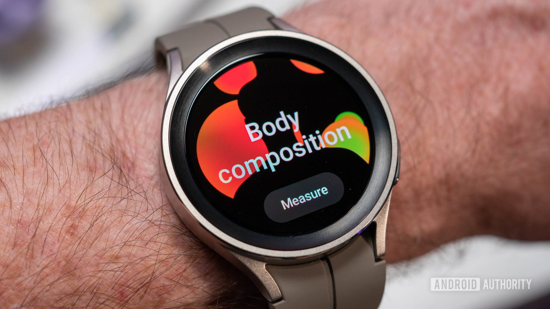 Samsung Galaxy Watch 5 Pro in silver color with fluoroelastomer wrist strap showing body composition screen