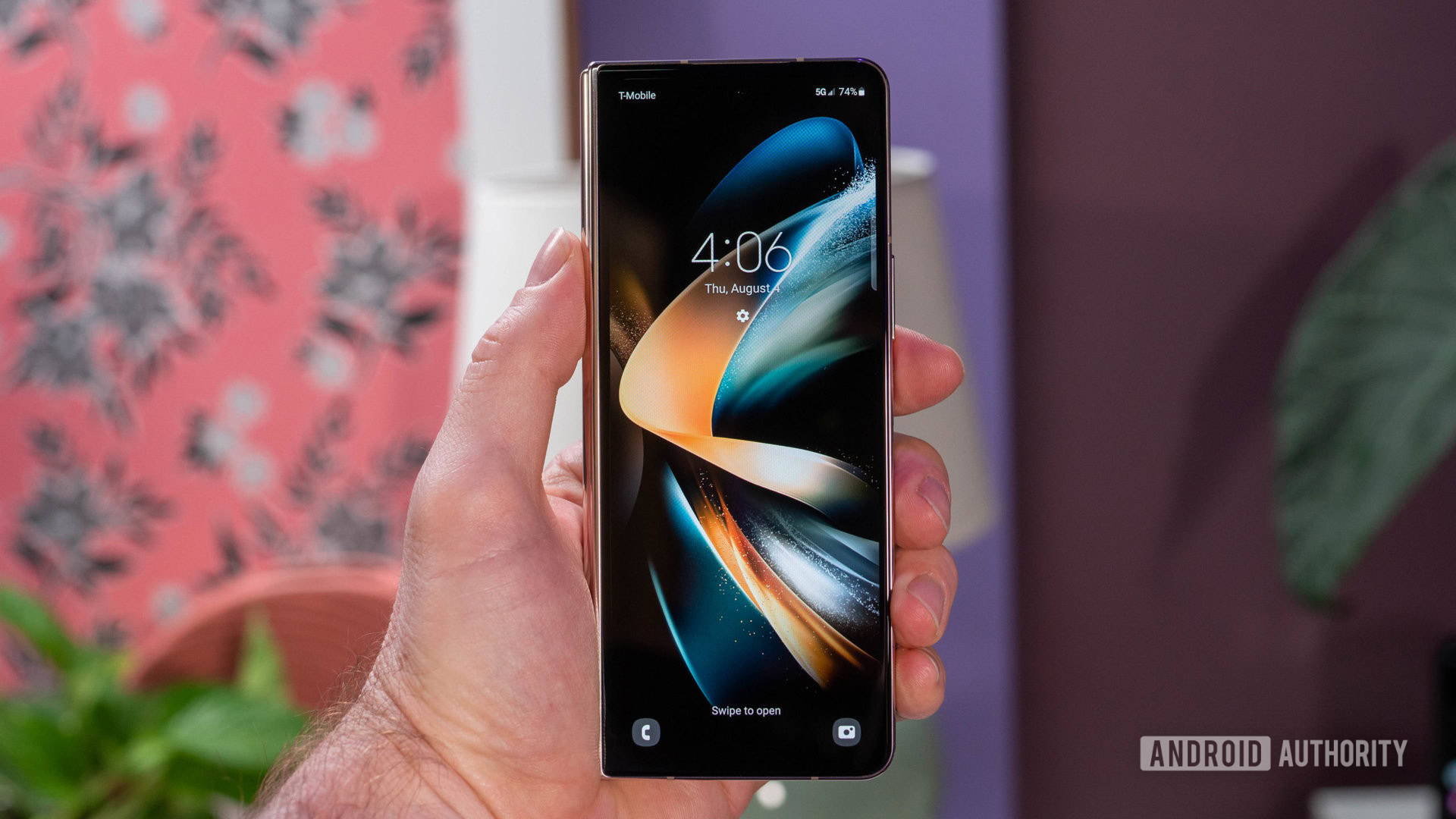 Samsung Galaxy Z Fold 4 in hand showing external display 2