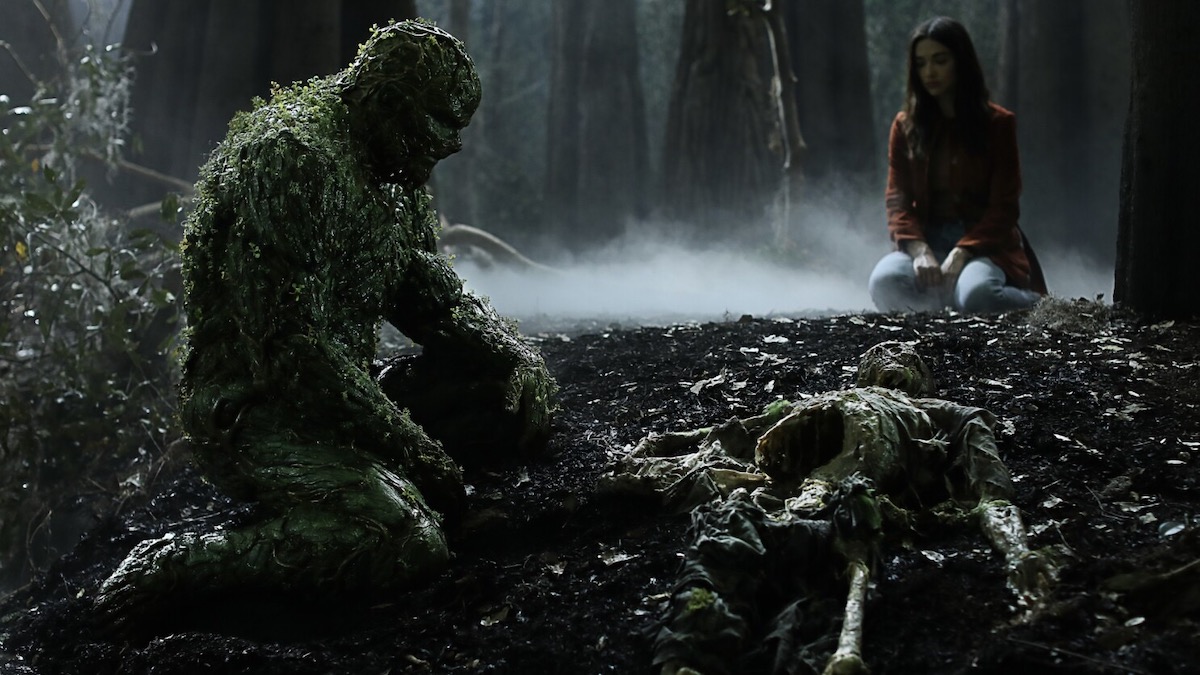 Swamp Thing looks at a skeleton in the swamp - shows like the sandman