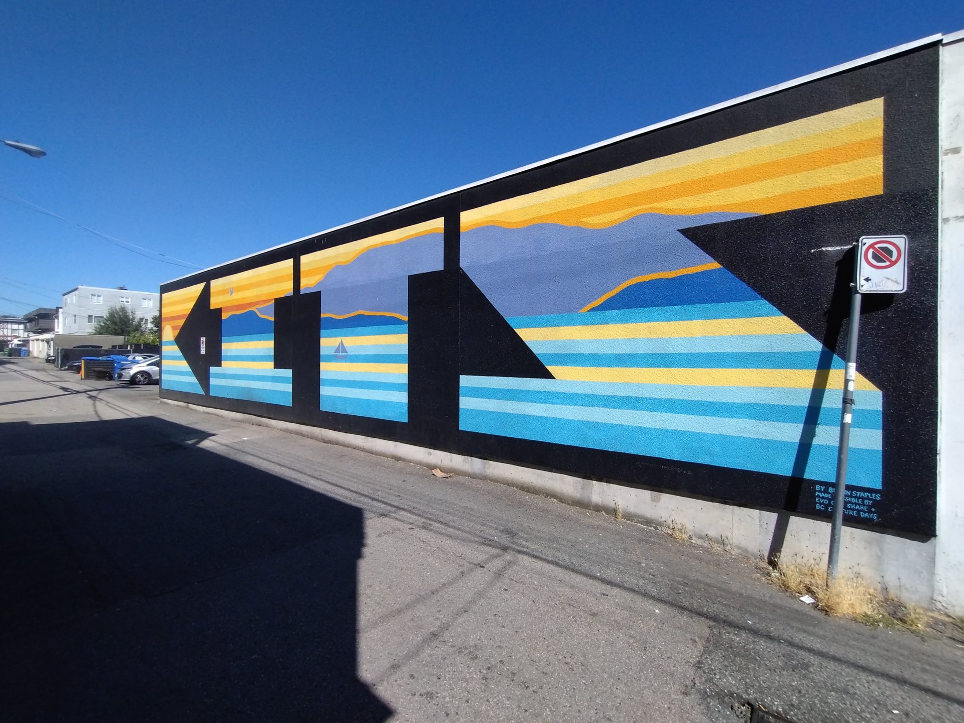 x0.6 blue and yellow mural against a blue sky