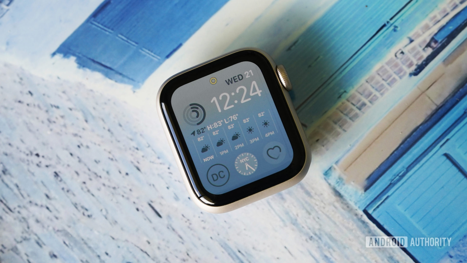 An Apple Watch SE 2 40mm watch case rests on a blue abstract surface.