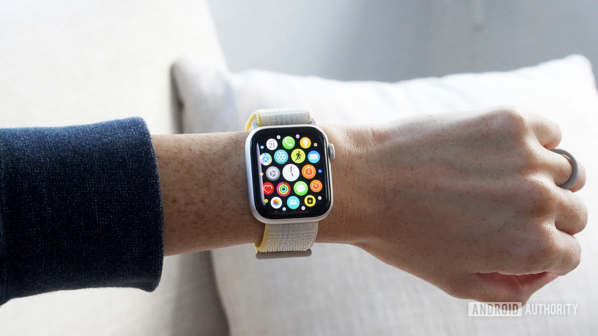 An Apple Watch SE on a user's wrist display the App Library.