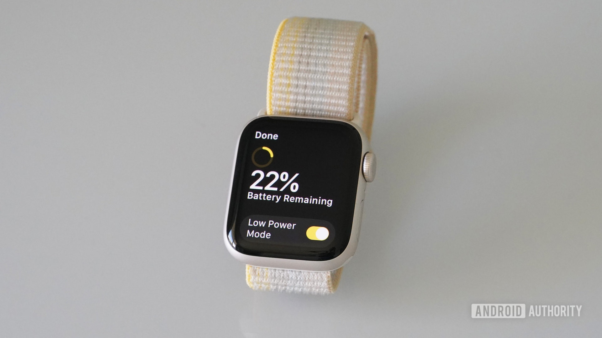 An Apple Watch SE 2 displays 22% battery and the Low Power Mode toggle.