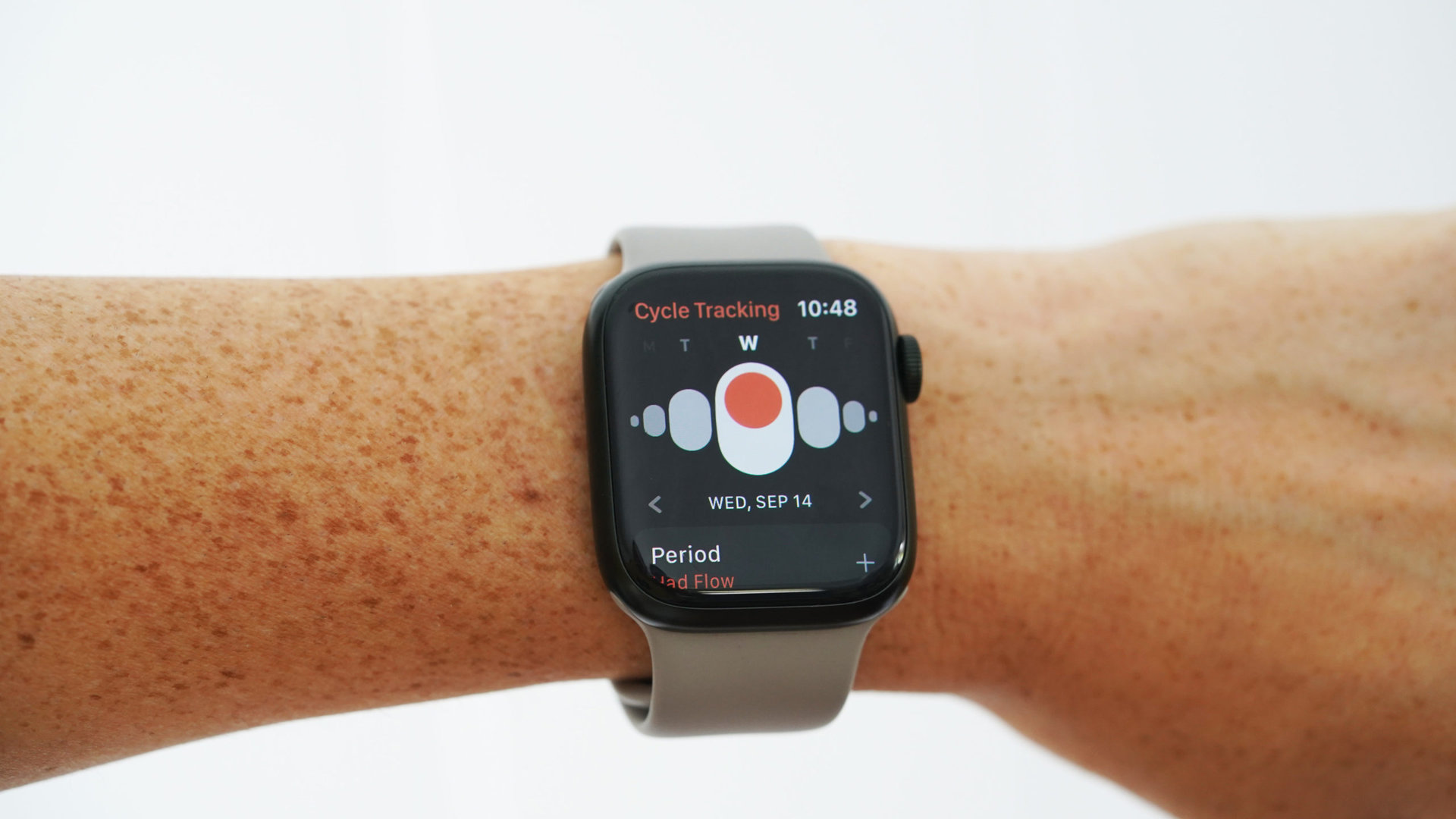 An Apple Watch Series 7 displays the Cycle Tracking app.