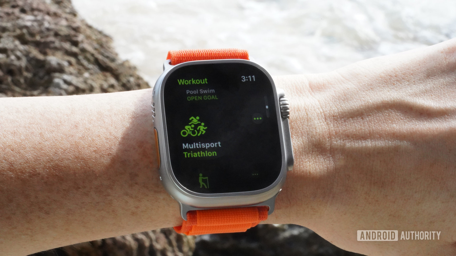 An Apple Watch Ultra displays the multisport workout screen.