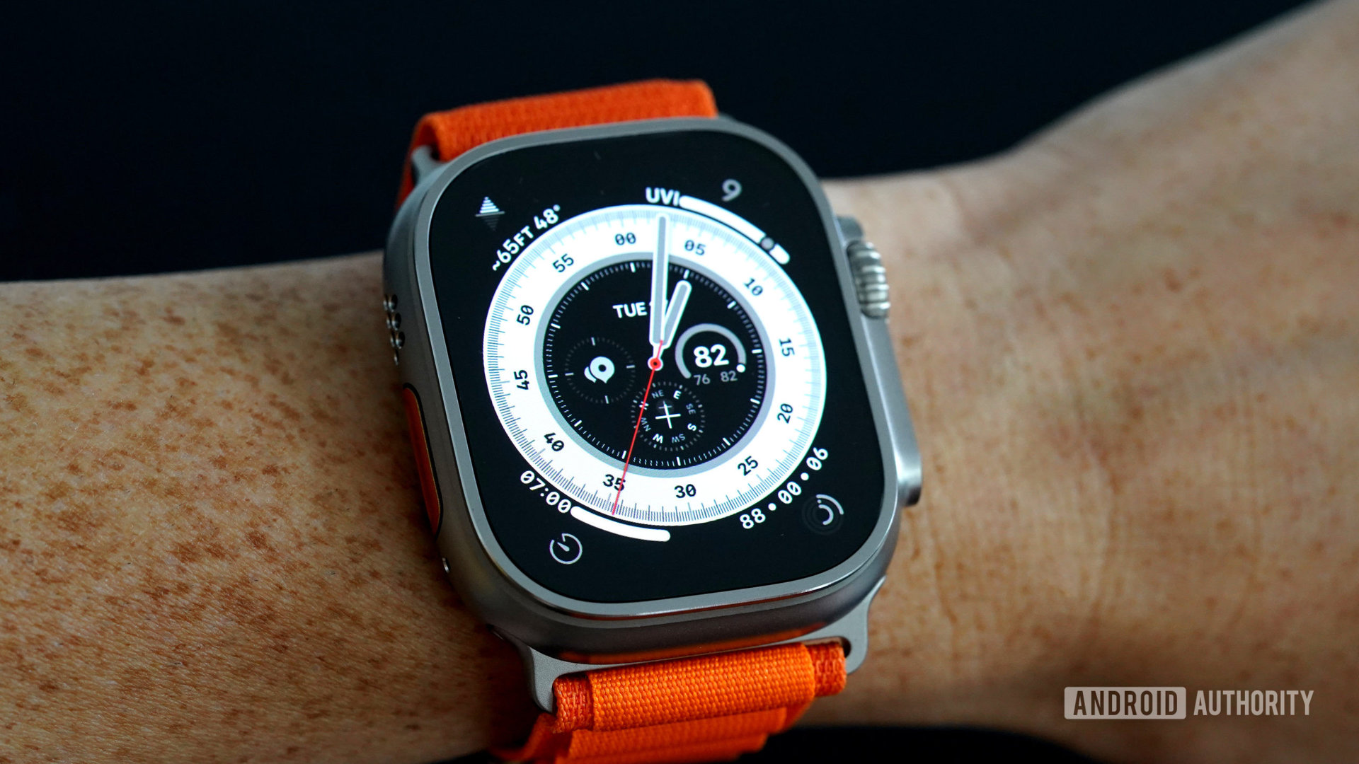 An Apple Watch Ultra displays its watch face on a user's wrist.