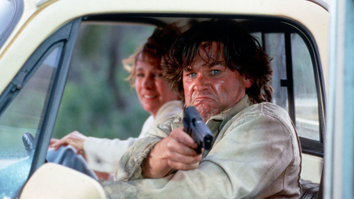 Kurt Russell protects hos wife in a car with a gun in Breakdown- movies leaving hbo max