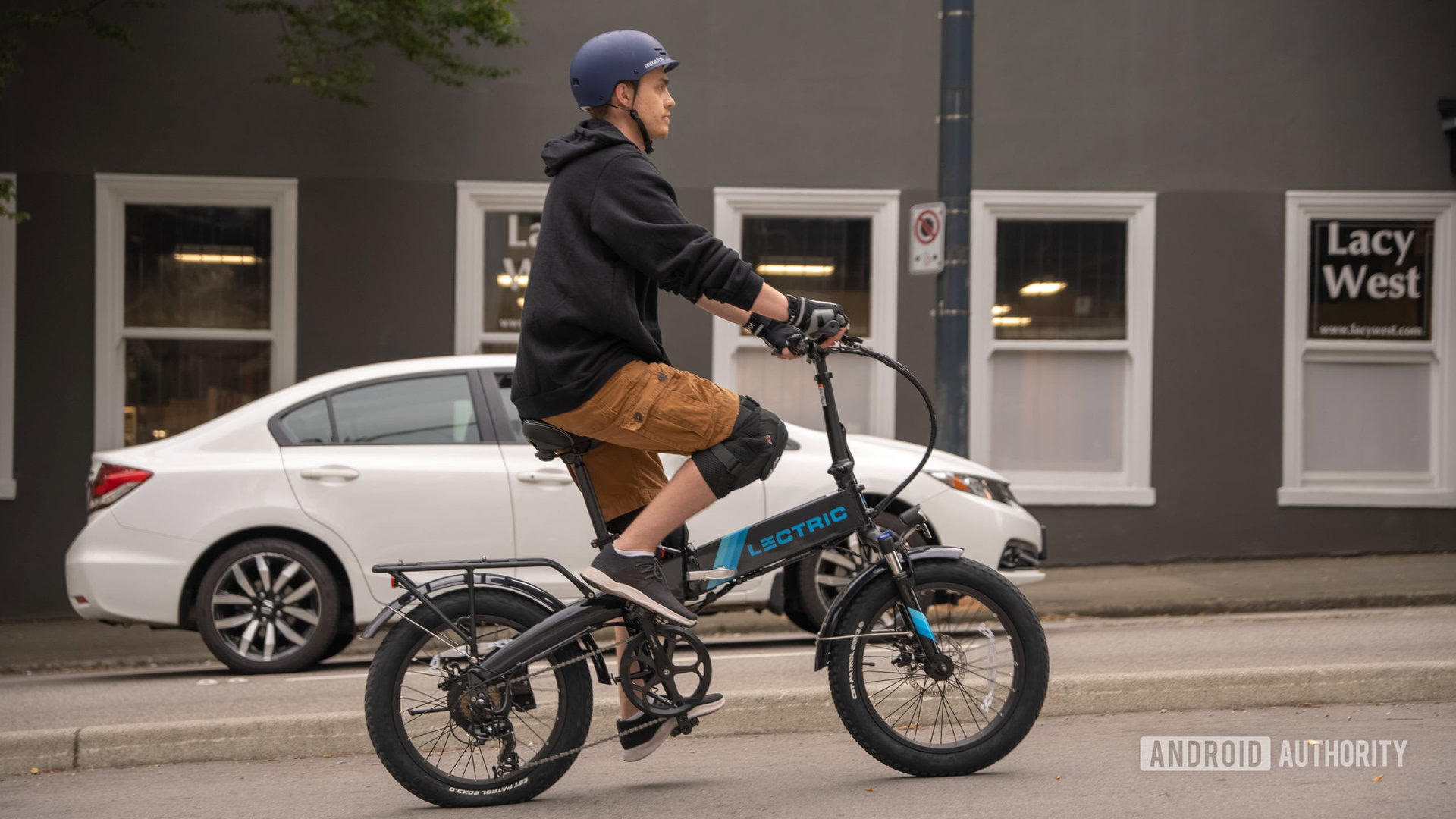 riding electric bicycle beside traffic