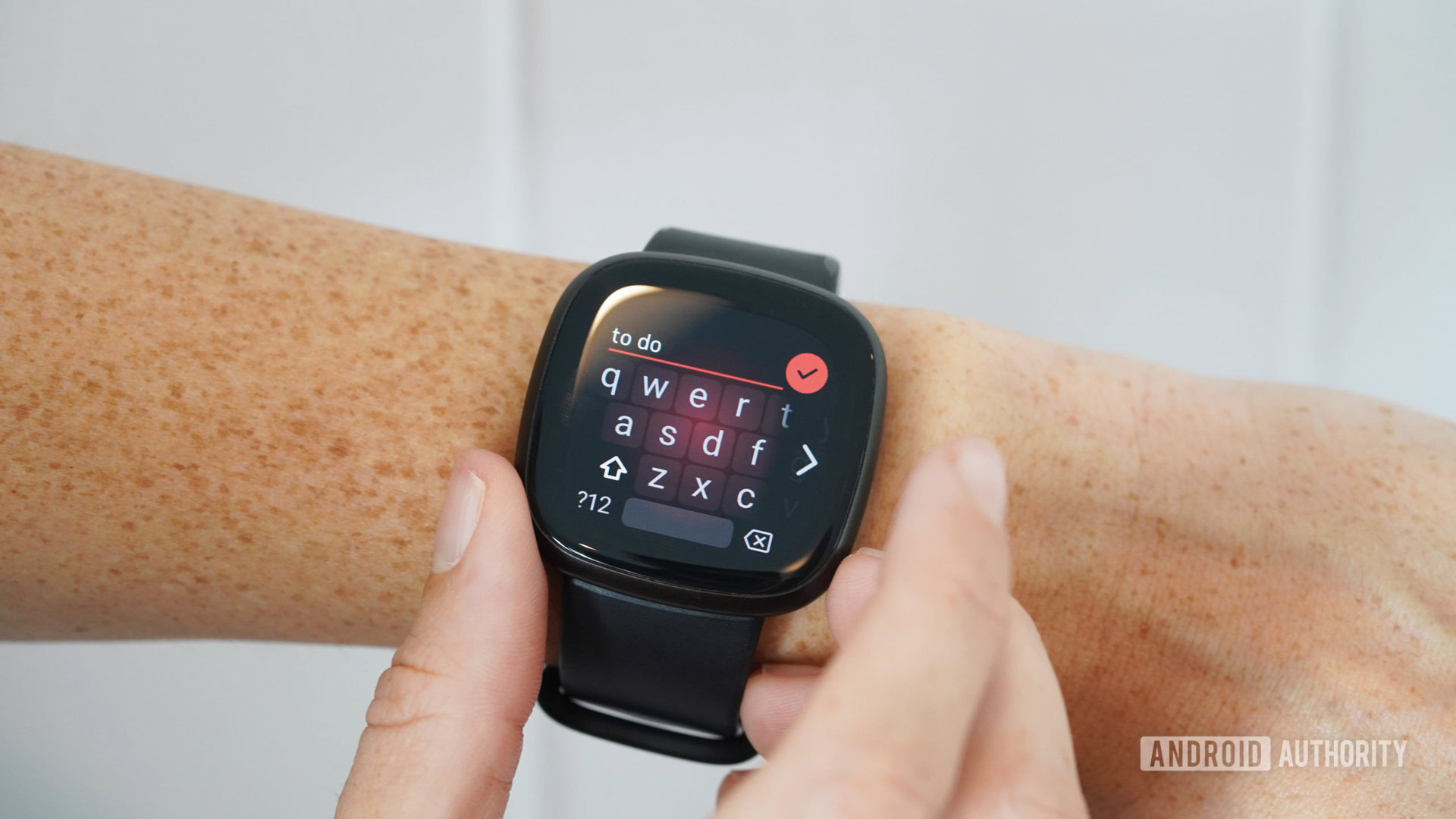 A user enters a to-do list in the Notes app on a Fitbit Versa 3.