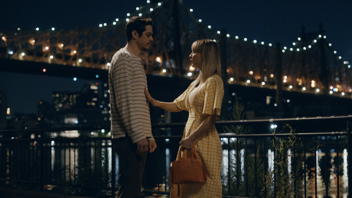 Pete Davidson as Gary and Kaley Cuoco as Sheila in front of a bridge in Meet Cute - best new streaming movies