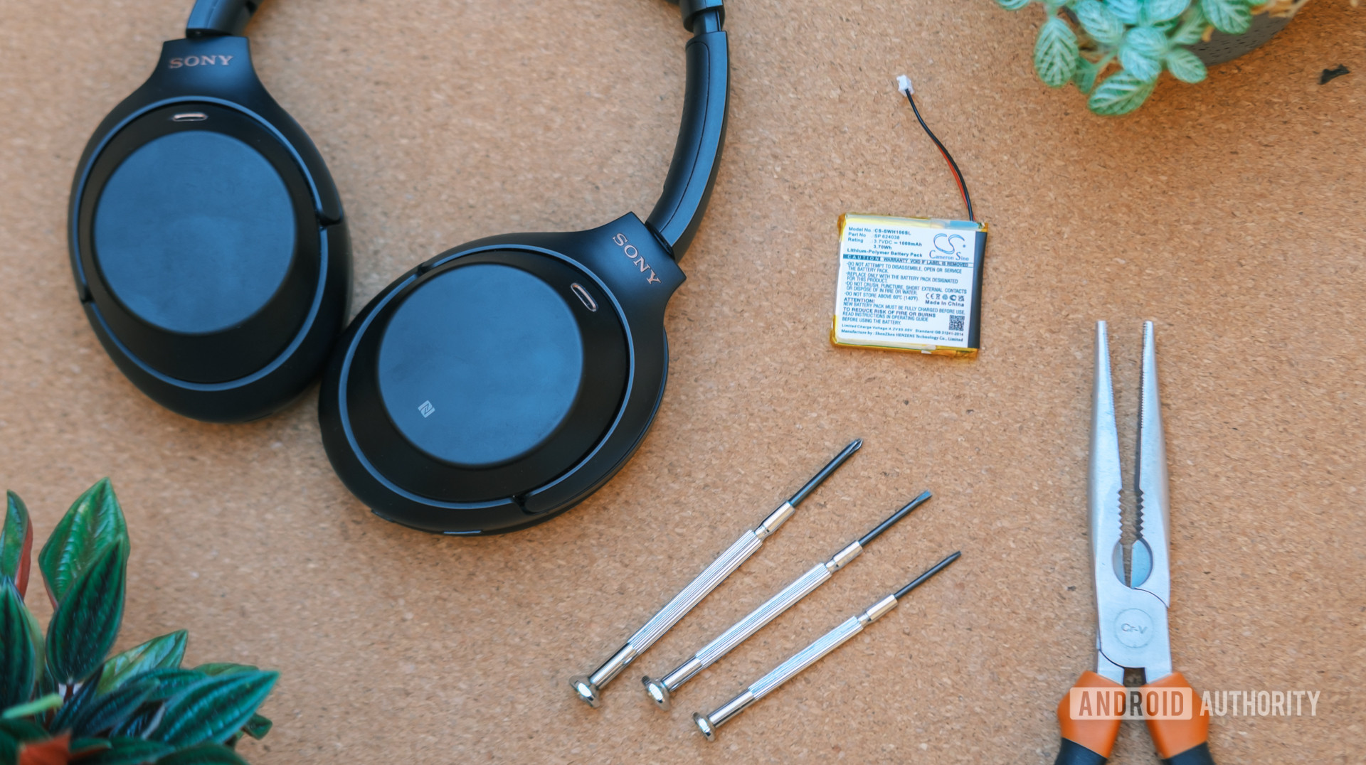 Sony WH 1000MX3 repair showing the headphones alongside various tools.
