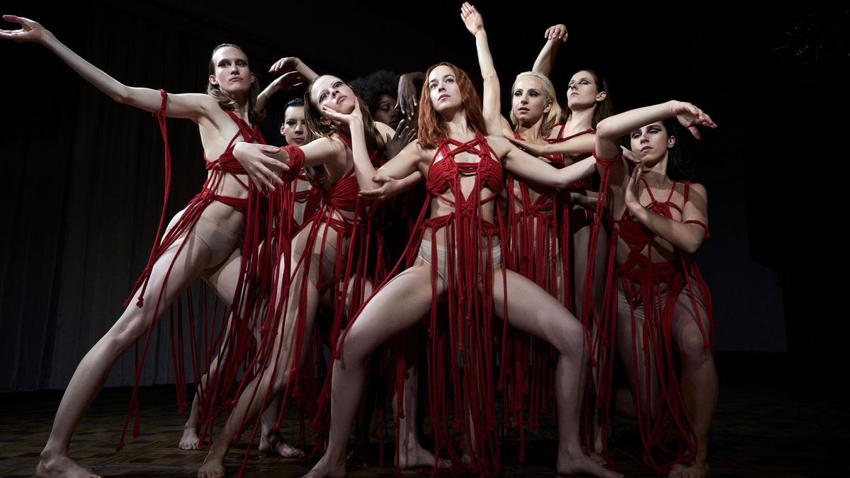 Dancers in bright red costumes in Suspiria