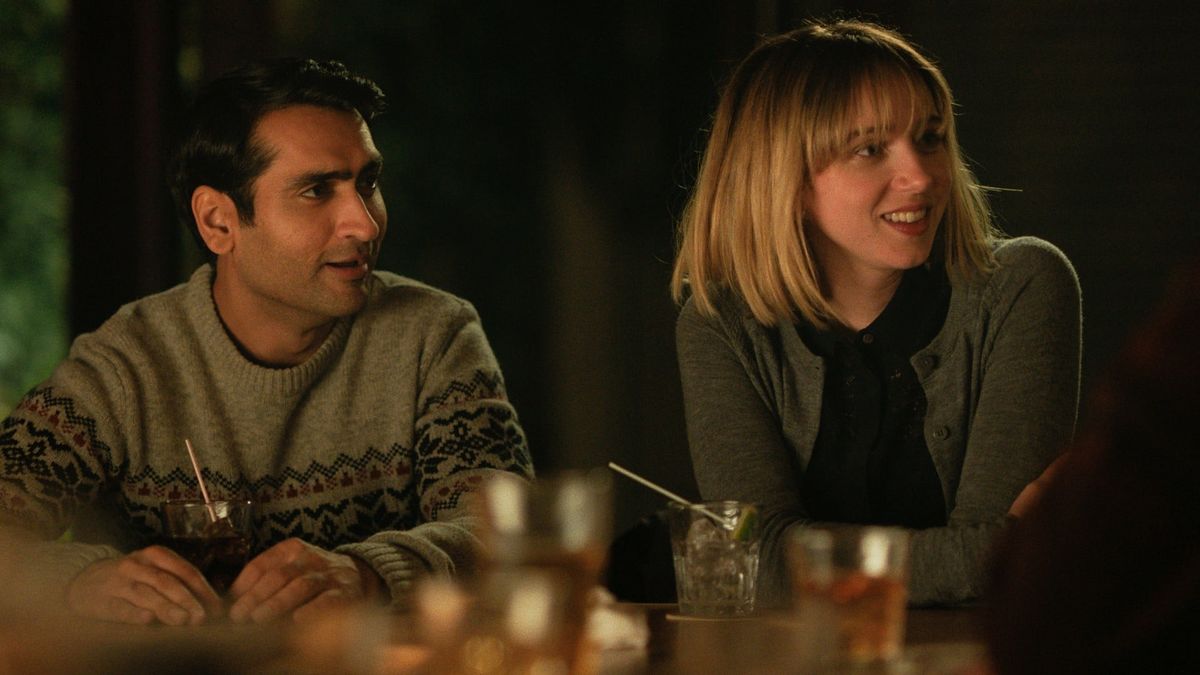 A couple sits at a dinner table in The Big Sick