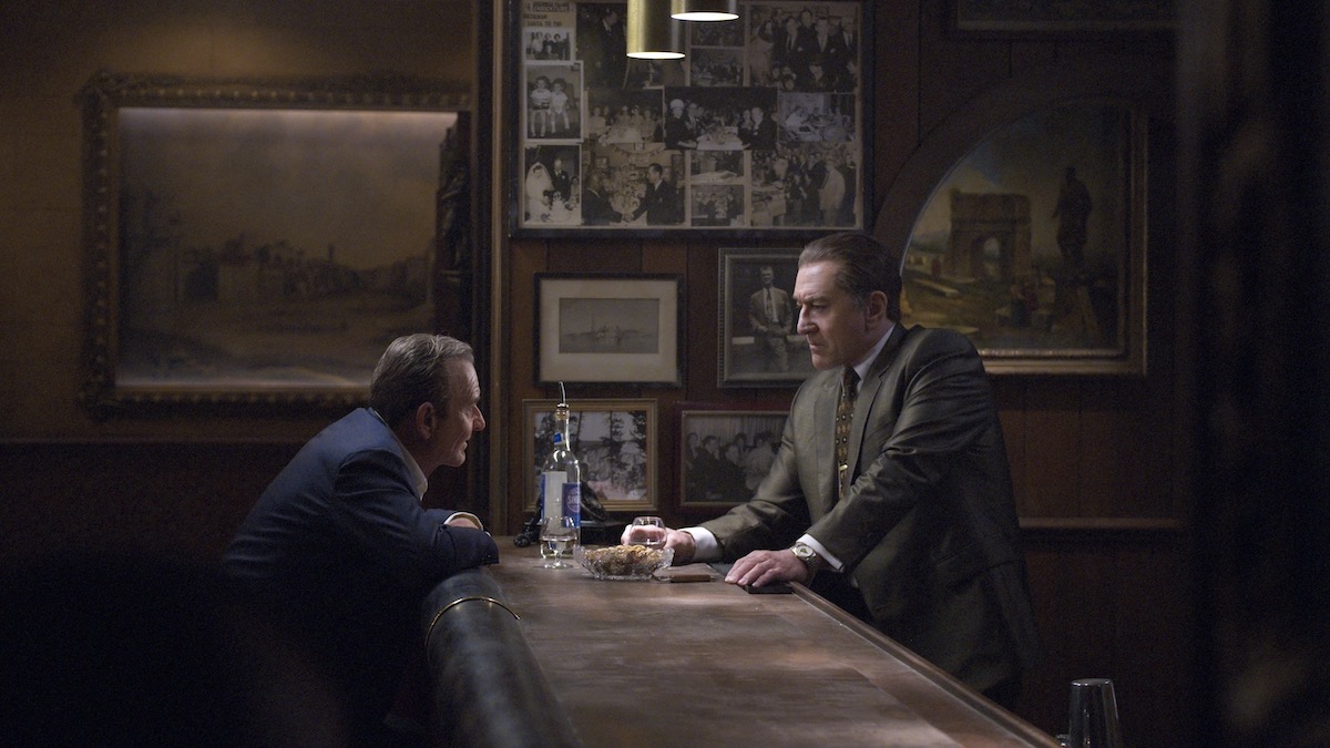 Joe Pesci and Robert De Niro drink together at a bar in The Irishman - best gangster movies on Netflix
