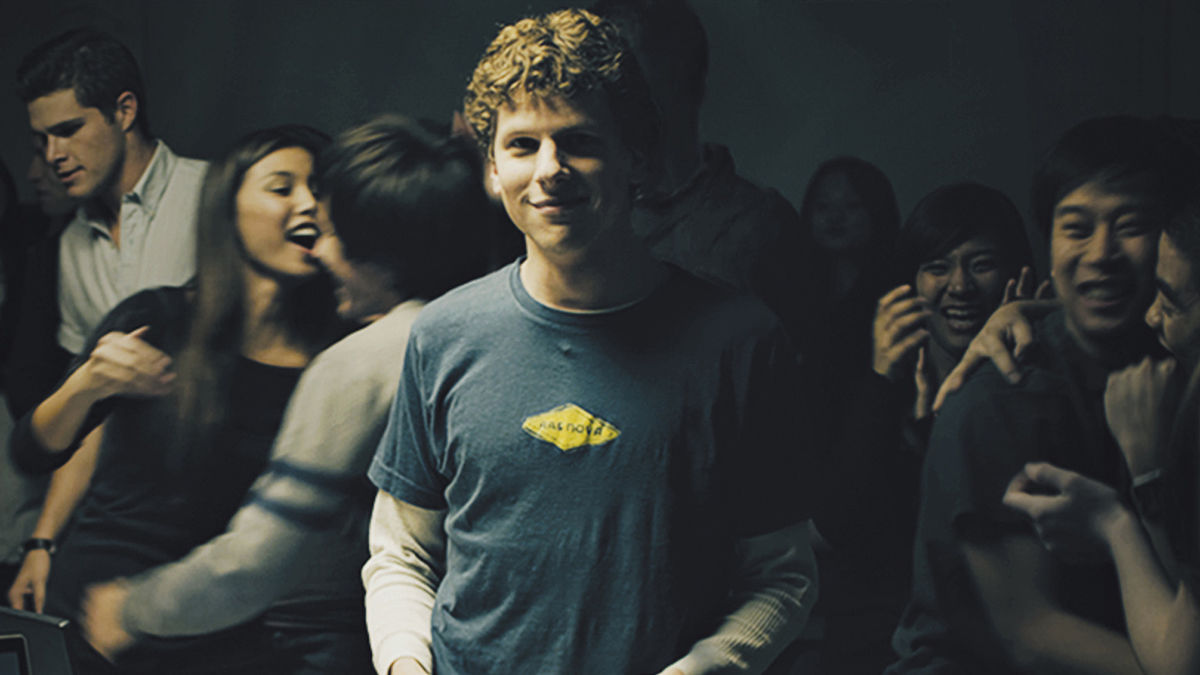 Mark Zuckerberg in a room full of people in The Social Network - movies leaving hulu